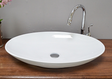 Large, oval washbasin as a countertop version
